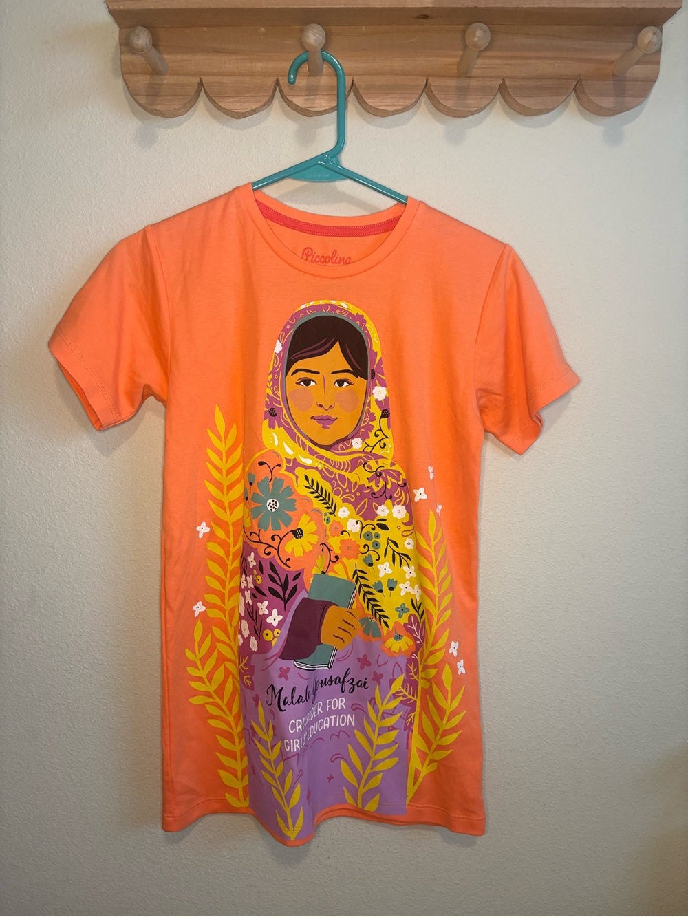 Kids Orange Graphic Tee with Floral Malala Illustration
